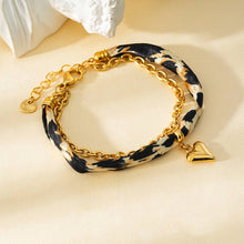 Afbeelding in Gallery-weergave laden, Eclat Paris - Leopard Fabric Bracelet with Gold Chain and Heart Pendant